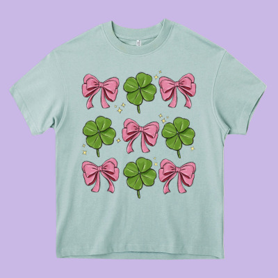 Coquette Bow Clover St. Patrick's Day Heavy Core Tee Designed By Maliassmallbusiness