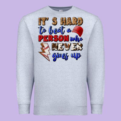 It's Hard To Beat A Person Who Never Gives Up Premium Sweatshirt Designed By Bundleandbundleshop