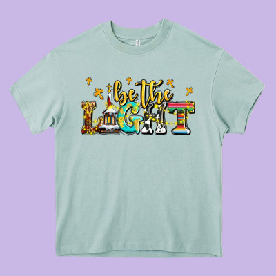 Be The Light Heavy Core Tee Designed By Adodesignshop