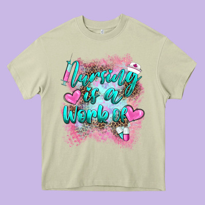 Nursing Is A Work Of Heavy Core Tee Designed By Barkaloodesign