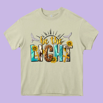 Be The Light Heavy Core Tee Designed By Nancycooperartshop