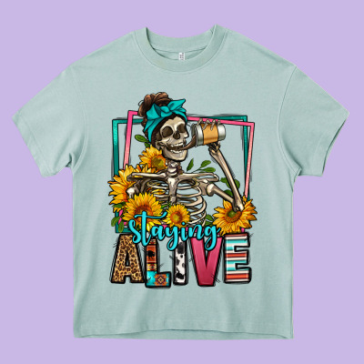 Staying Alive Coffee Drinking Skeleton Heavy Core Tee Designed By Jasminsmagicworld
