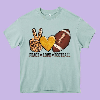 Peace Love Football Heavy Core Tee Designed By Adodesignshop
