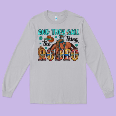 And They Call The Thing Rodeo Long Sleeve Tee Designed By Artiststas