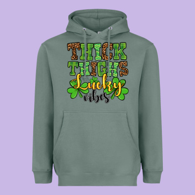 St. Patrick's Thick Thighs Lucky Vibes Heavyweight Hoodie Designed By Oliviacreatesart