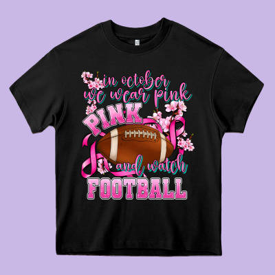 In October We Wear Pink And Watch Football Heavy Core Tee Designed By Adodesignshop