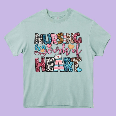 Nursing Is A Work Of Heart Heavy Core Tee Designed By Bundleandbundleshop