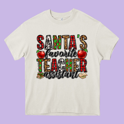 Santa's Favorite Teacher Assistant Heavy Core Tee Designed By Jasminsmagicworld