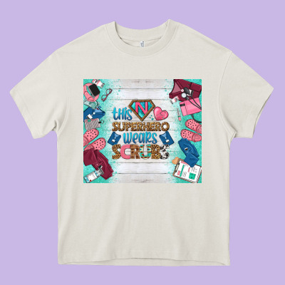 This Superhero Wears Scrubs Tumbler Heavy Core Tee Designed By Bundleandbundleshop
