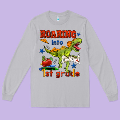 Roaring Into 1st Grade Long Sleeve Tee Designed By Bundleandbundleshop