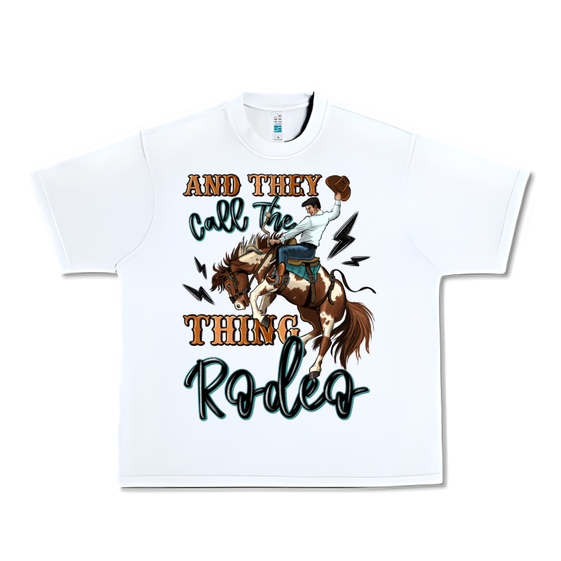 And They Call The Thing Rodeo Cowboy Urban Heavy Tee by MaliasSmallBusiness | Teevron