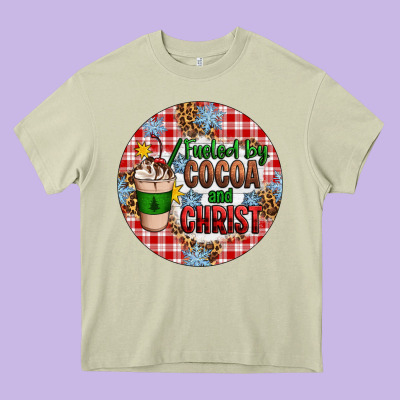 Christmas Fueled By Cocoa And Christ Ornament Heavy Core Tee Designed By Artiststas