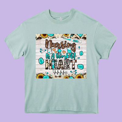 Nursing Is A Work Of Heart Heavy Core Tee Designed By Jahusdesignshop