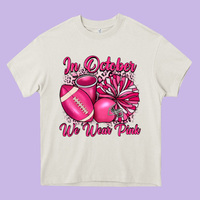 In October We Wear Pink Cheer With Football Breast Heavy Core Tee Designed By Jahusdesignshop