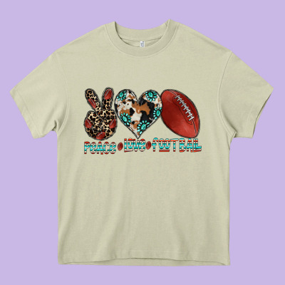Peace Love Football Heavy Core Tee Designed By Cowhidedigitalart