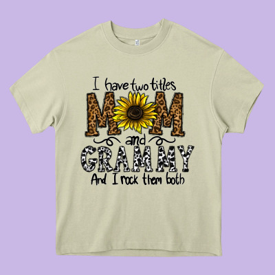 I Have Two Titles Mom And Grmmh And I Rock Them Both Heavy Core Tee Designed By Cowhidedigitalart