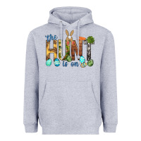 Heather Grey The hunt is on with eggs Easter Day Heavyweight Hoodie - HowdyJamesFarm
