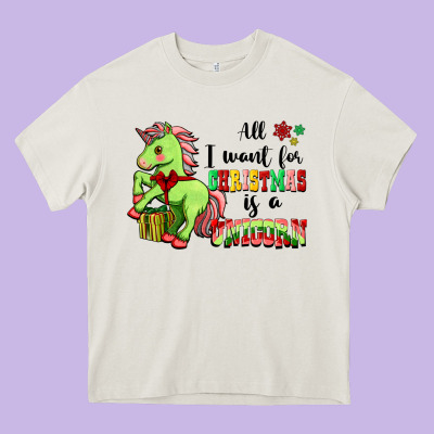 All I Want For Christmas Is A Unicorn Heavy Core Tee Designed By Fadigitalartstudio