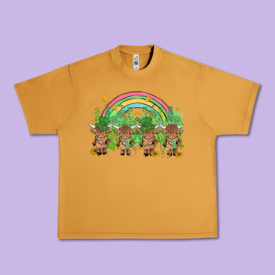 St Patrick's Day Baby Highland Cow Urban Heavy Tee Designed By Maliassmallbusiness