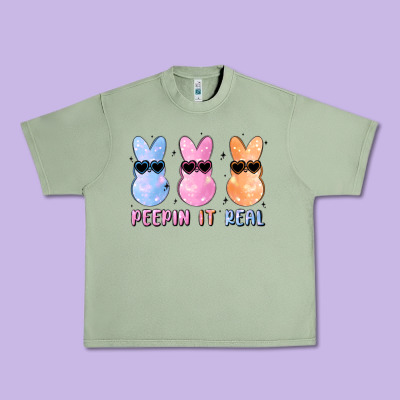 Peepin It Real Easter Glitter Urban Heavy Tee Designed By Maliassmallbusiness