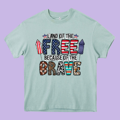 Land Of The Beacause Of The Brave Heavy Core Tee Designed By Cowhidedigitalart