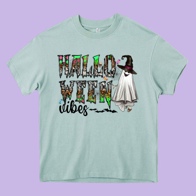 Halloween Vibes Heavy Core Tee Designed By Cowhidedigitalart