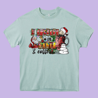 I Believe In Santa And Coffee Heavy Core Tee Designed By Cowhidedigitalart