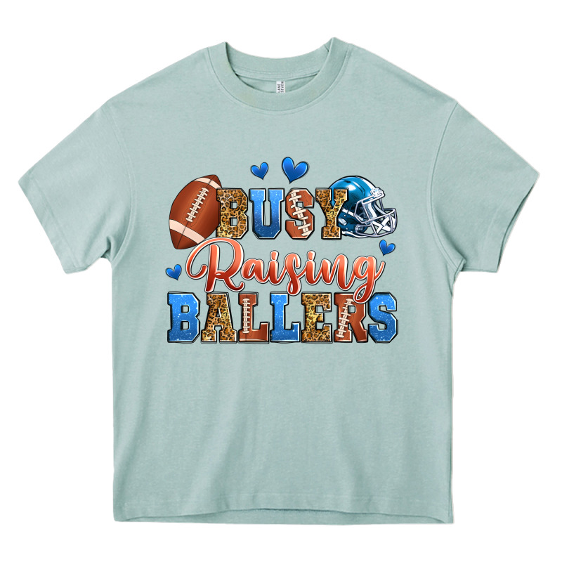 Busy Raising Ballers American Football Heavy Core Tee by Zillion Design Studio | Teevron