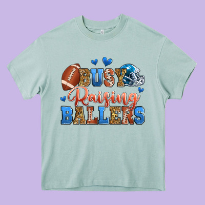 Busy Raising Ballers American Football Heavy Core Tee Designed By Zillion Design Studio
