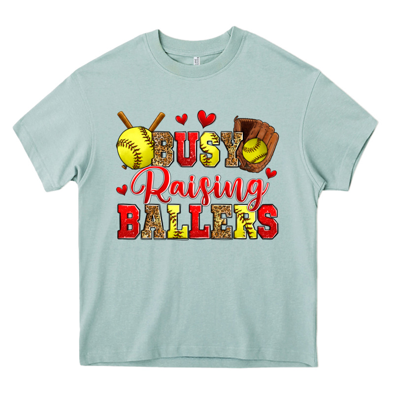 Busy Raising Ballers Softball Heavy Core Tee by Zillion Design Studio | Teevron