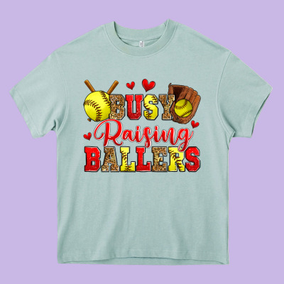 Busy Raising Ballers Softball Heavy Core Tee Designed By Zillion Design Studio