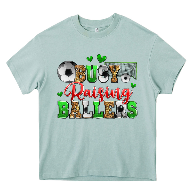 Busy Raising Ballers Soccer Heavy Core Tee by Zillion Design Studio | Teevron