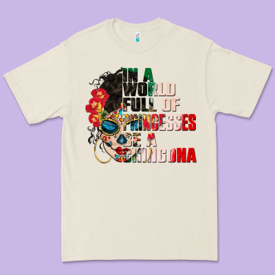 In A World Full Of Princesses Be A Chingona Premium Tee Designed By Cts Tumbler Store