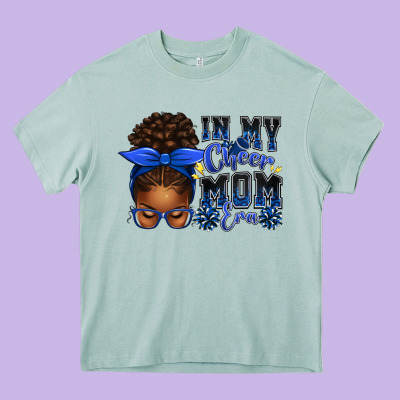 In My Cheer Mom Era Afro Messy Bun Heavy Core Tee Designed By Texasbilliewilder