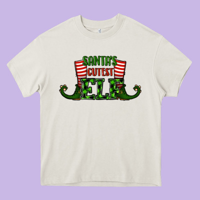 Santa's Cutest Elf Christmas Heavy Core Tee Designed By Ranaportraitstore