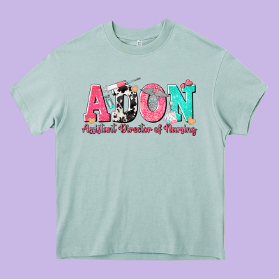Adon Assistant Director Of Nursing Heavy Core Tee Designed By Texasbilliewilder