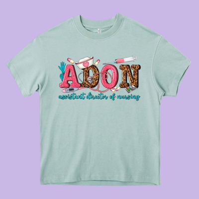 Assistant Director Of Nursing Heavy Core Tee Designed By Texasbilliewilder
