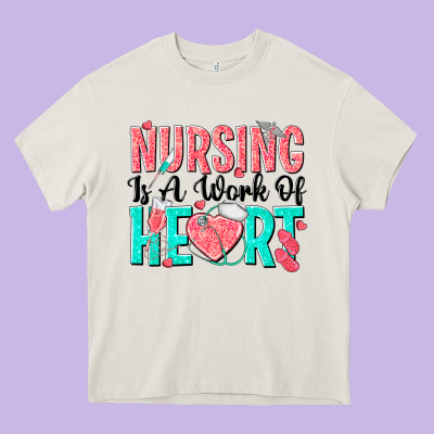 Nursing Is A Work Of Heart Heavy Core Tee Designed By Texasbilliewilder