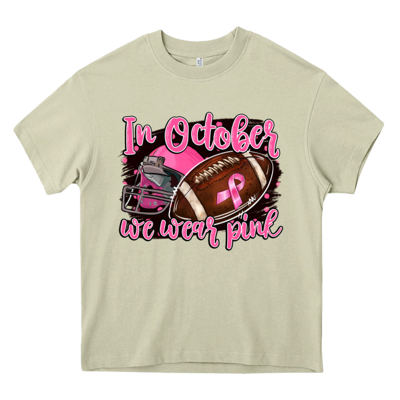 In October We Wear Pink With Football Heavy Core Tee by BarkalooDesign | Teevron