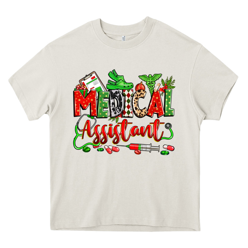 Christmas Medical Assistant Heavy Core Tee by Zillion Design Studio | Teevron