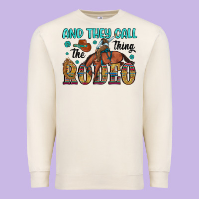 And They Call The Thing Rodeo Premium Sweatshirt Designed By Artiststas