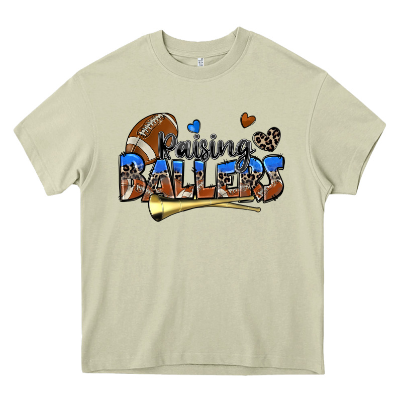 Raising Ballers Football Heavy Core Tee by Zillion Design Studio | Teevron