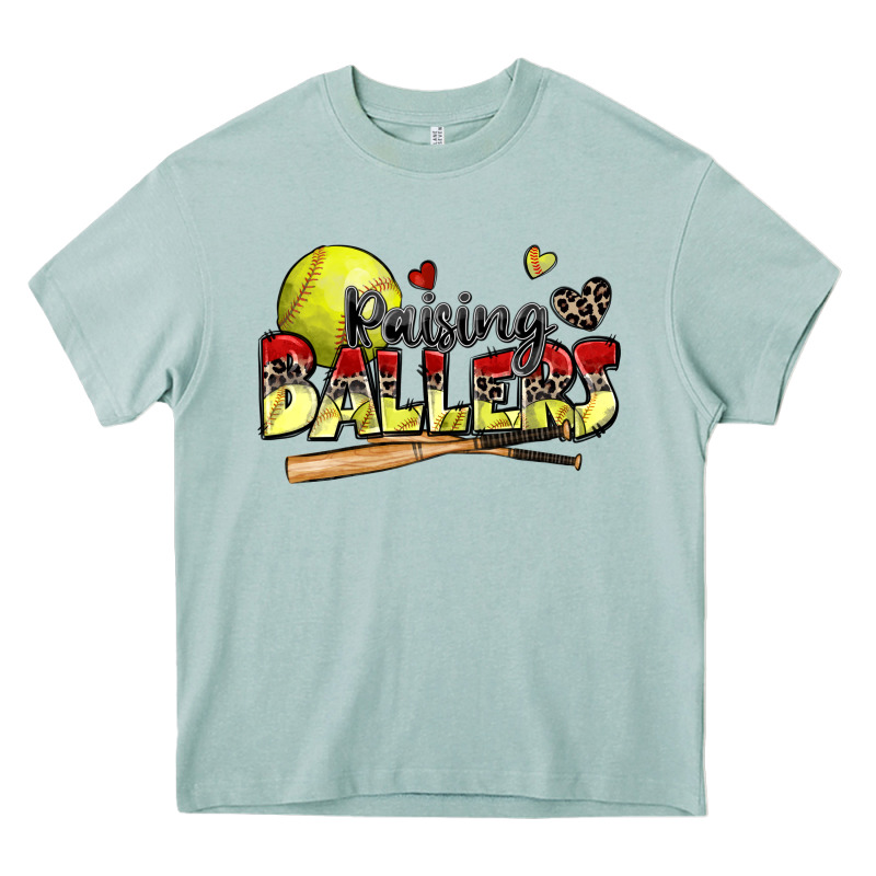 Raising Ballers Softball Heavy Core Tee by Zillion Design Studio | Teevron
