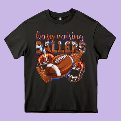 Busy Raising Ballers Football Heavy Core Tee Designed By Texasbilliewilder