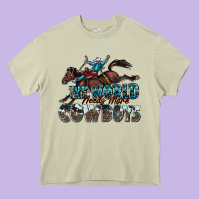 The World Needs More Cowboys Heavy Core Tee Designed By Zillion Design Studio