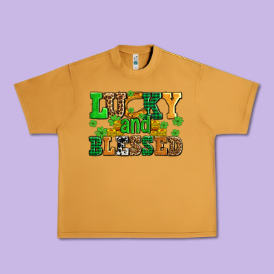 Lucky And Blessed With Coins And Shamrocks Urban Heavy Tee Designed By Adodesignshop