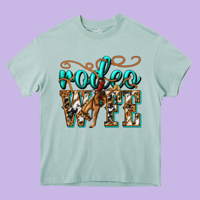 Rodeo Wife Western Heavy Core Tee Designed By Texasbilliewilder