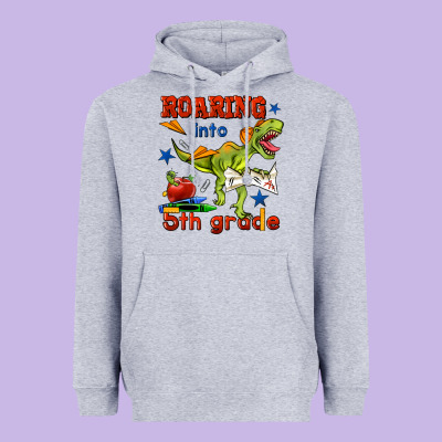 Roaring Into 5th Grade Heavyweight Hoodie Designed By Bundleandbundleshop