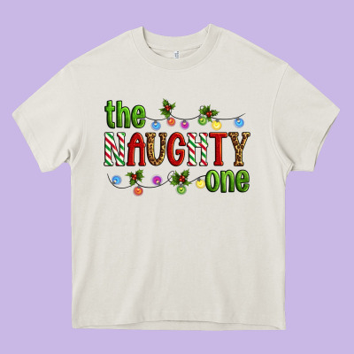 The Naughty One Christmas Heavy Core Tee Designed By Artiststas