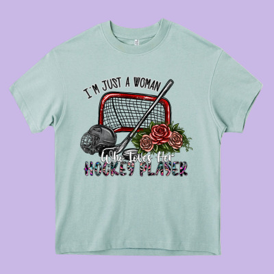 I'm Just A Woman Who Loves Her Hockey Player Heavy Core Tee Designed By Sublimationcraftshop